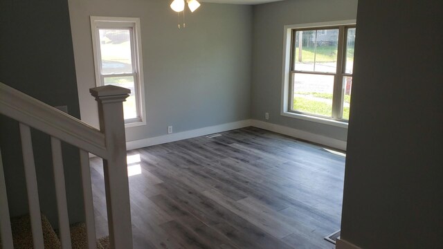 402 W Fulton St, Polo, IL 61064 - unfurnished room with baseboards, wood finished floors, and ceiling fan