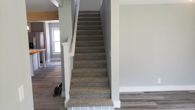 402 W Fulton St, Polo, IL 61064 - stairway featuring wood finished floors and baseboards
