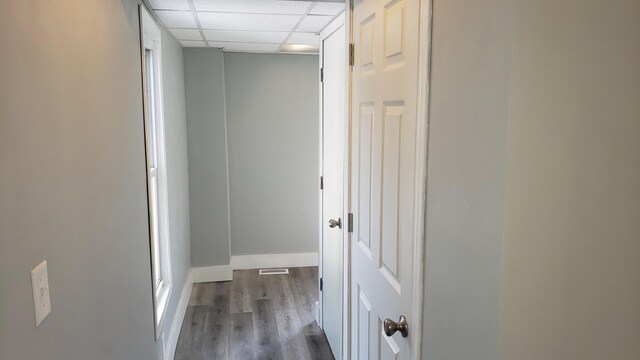 402 W Fulton St, Polo, IL 61064 - hall with a drop ceiling, wood finished floors, and baseboards