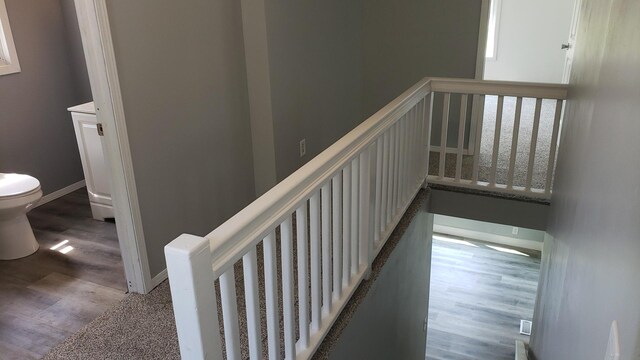 402 W Fulton St, Polo, IL 61064 - stairs featuring wood finished floors and baseboards