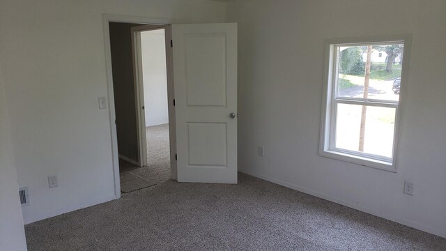 402 W Fulton St, Polo, IL 61064 - unfurnished room with carpet floors and baseboards