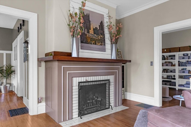 320 E Locust St, Watseka, IL 60970 - detailed view of wood finished floors, ornamental molding, and a fireplace
