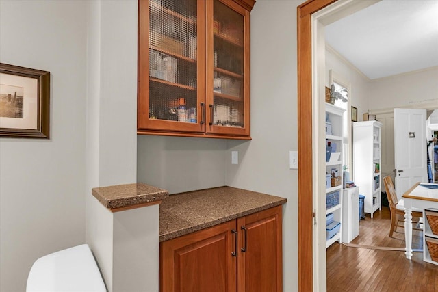 320 E Locust St, Watseka, IL 60970 - bar featuring dark wood-style floors and crown molding