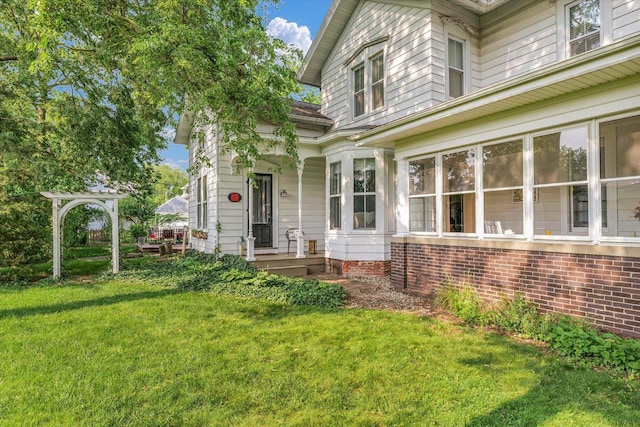 320 E Locust St, Watseka, IL 60970 - property entrance with a yard and a porch