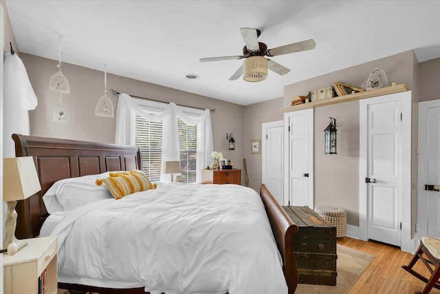 320 E Locust St, Watseka, IL 60970 - bedroom featuring light wood-type flooring and a ceiling fan