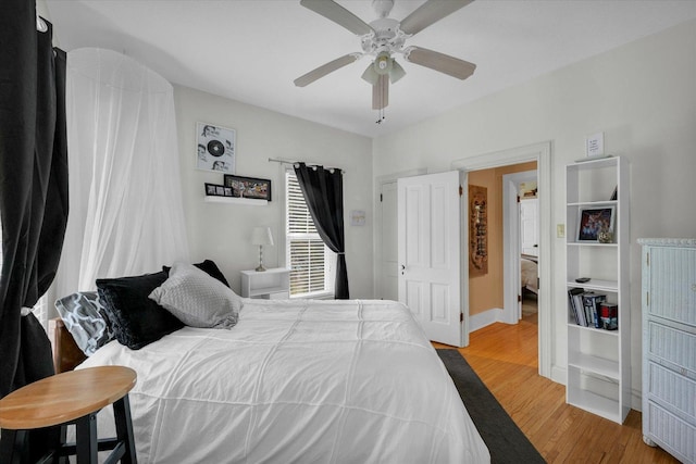 320 E Locust St, Watseka, IL 60970 - bedroom featuring wood finished floors and a ceiling fan