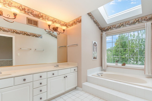 2015 Steward Ln, Plainfield, IL 60586 - bathroom with a skylight, double vanity, a bath, and tile patterned flooring