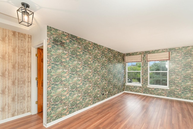 2015 Steward Ln, Plainfield, IL 60586 - unfurnished room with wallpapered walls, wood finished floors, and baseboards