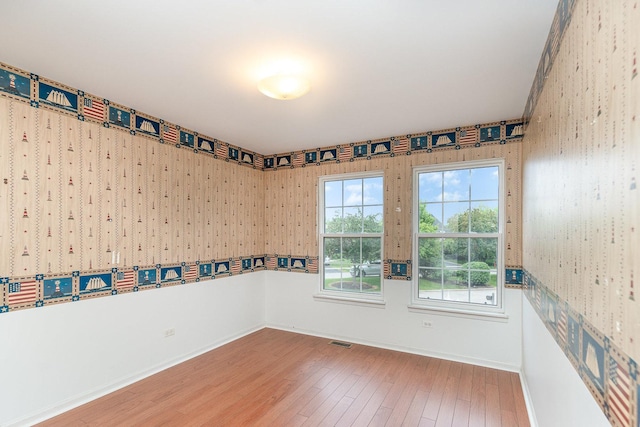 2015 Steward Ln, Plainfield, IL 60586 - empty room with wood-type flooring, baseboards, and wallpapered walls