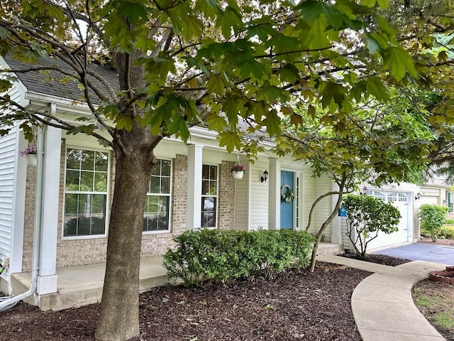 2015 Steward Ln, Plainfield, IL 60586 - doorway to property featuring brick siding and a porch