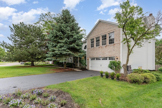 2015 Steward Ln, Plainfield, IL 60586 - view of side of property featuring asphalt driveway, brick siding, a yard, and an attached garage