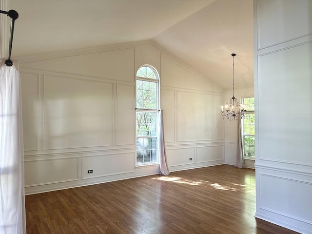 2015 Steward Ln, Plainfield, IL 60586 - spare room with a decorative wall, dark wood-style floors, a chandelier, and vaulted ceiling