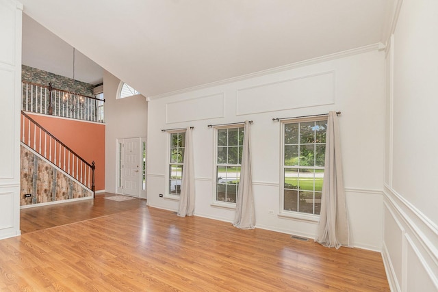 2015 Steward Ln, Plainfield, IL 60586 - entryway with a chandelier, stairway, healthy amount of natural light, light wood-type flooring, and a decorative wall