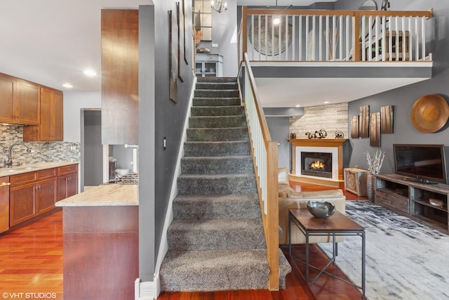 1959 Lancaster Ct Unit 4, Naperville, IL 60565 - stairway featuring wood finished floors, a fireplace, and recessed lighting