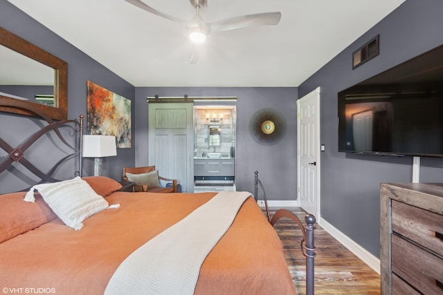 1959 Lancaster Ct Unit 4, Naperville, IL 60565 - bedroom with wood finished floors, a barn door, ensuite bath, and ceiling fan
