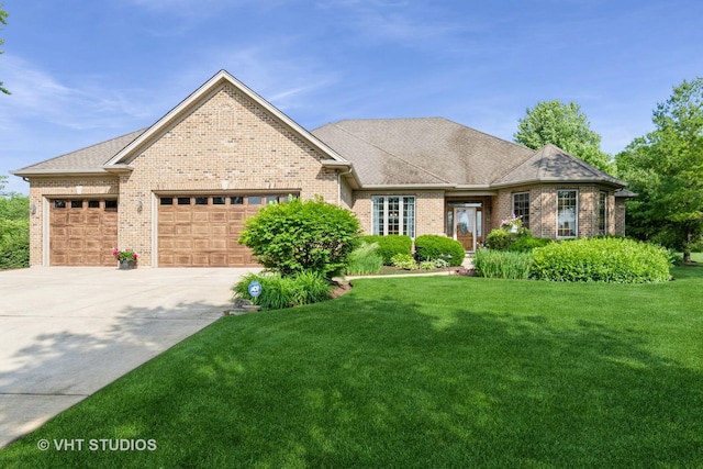 8820 Wilcox Ct, Newark, IL 60541 - view of front of property with brick siding, a garage, concrete driveway, a front yard, and roof with shingles