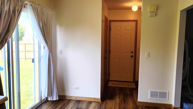 831 Hickory Ct, Marengo, IL 60152 - hallway featuring plenty of natural light, wood finished floors, and baseboards