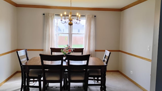 831 Hickory Ct, Marengo, IL 60152 - dining space featuring a chandelier, crown molding, baseboards, and light colored carpet