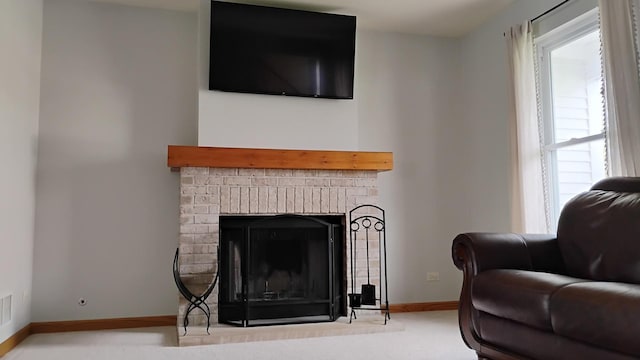 831 Hickory Ct, Marengo, IL 60152 - carpeted living room with a fireplace and baseboards