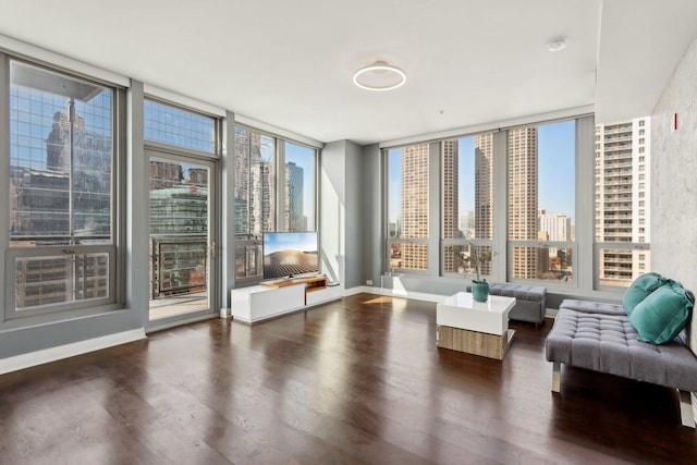 565 W Quincy St Unit 1606, Chicago, IL 60661 - living room featuring wood finished floors, plenty of natural light, and baseboards