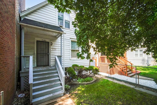 1340 E 76th St, Chicago, IL 60619 - doorway to property featuring a chimney and roof with shingles