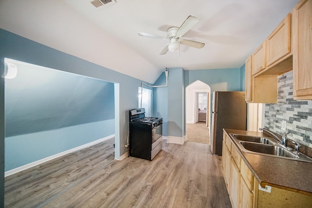 1340 E 76th St, Chicago, IL 60619 - kitchen with appliances with stainless steel finishes, light brown cabinets, a sink, ceiling fan, and lofted ceiling