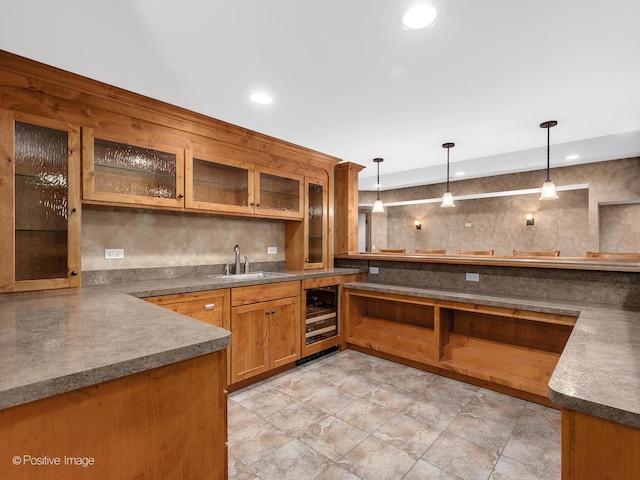 456 S Julian St, Naperville, IL 60540 - kitchen featuring wine cooler, pendant lighting, brown cabinets, glass insert cabinets, and light stone finish flooring