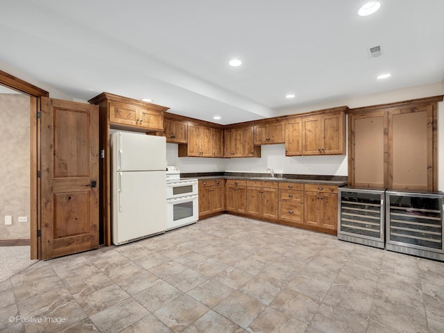 456 S Julian St, Naperville, IL 60540 - kitchen featuring white appliances, dark countertops, recessed lighting, wine cooler, and brown cabinets