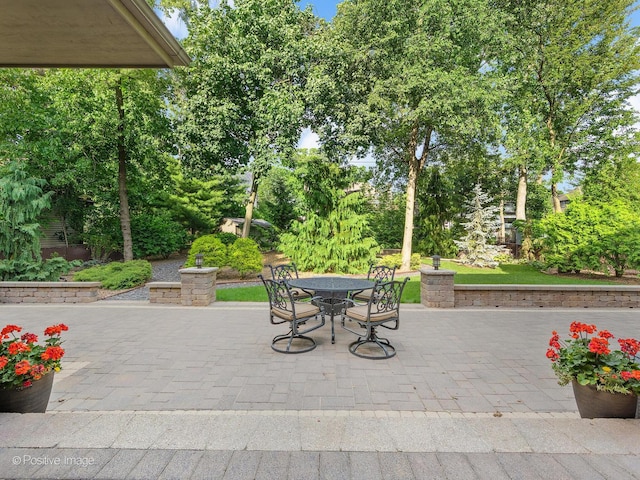 456 S Julian St, Naperville, IL 60540 - view of patio / terrace with outdoor dining space and view of wooded area