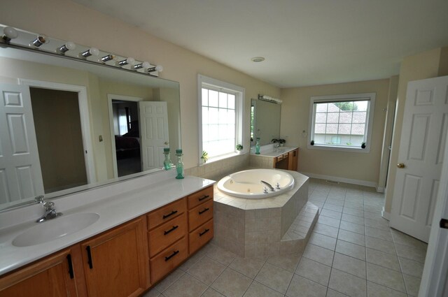 606 Reserve Ln, Joliet, IL 60431 - full bathroom with a bath, vanity, tile patterned floors, and baseboards