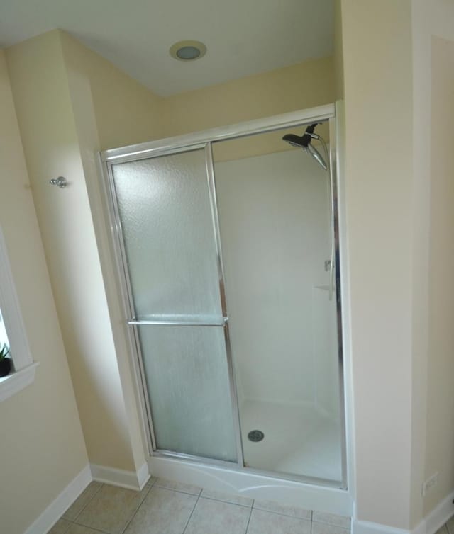 606 Reserve Ln, Joliet, IL 60431 - bathroom featuring a shower stall and tile patterned flooring