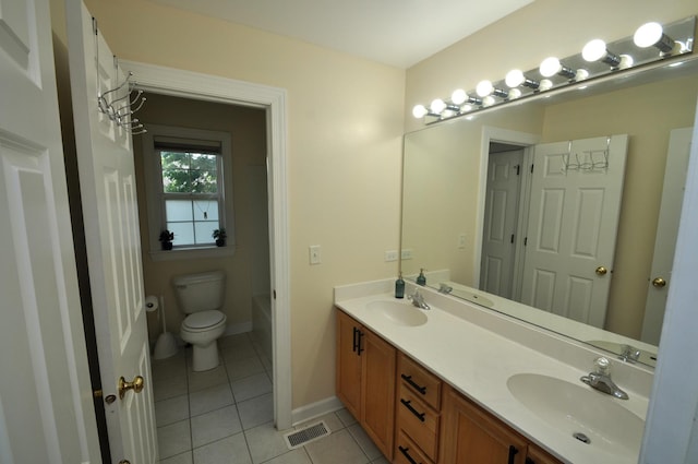 606 Reserve Ln, Joliet, IL 60431 - bathroom featuring tile patterned flooring, double vanity, toilet, baseboards, and bathing tub / shower combination
