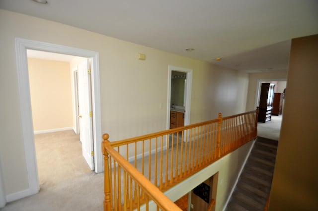 606 Reserve Ln, Joliet, IL 60431 - corridor featuring an upstairs landing, carpet flooring, and baseboards