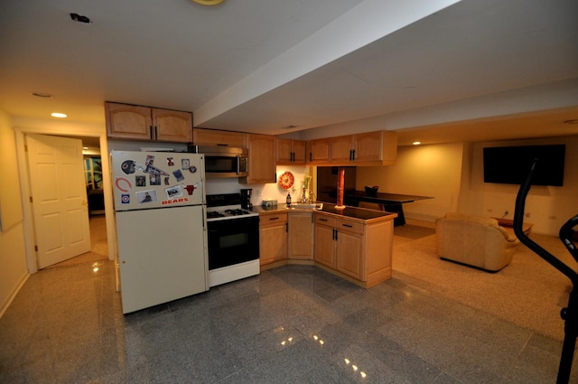 606 Reserve Ln, Joliet, IL 60431 - kitchen with gas stove, freestanding refrigerator, stainless steel microwave, a peninsula, and baseboards