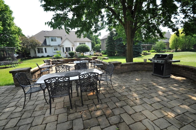 606 Reserve Ln, Joliet, IL 60431 - view of patio / terrace with a trampoline, outdoor dining area, and area for grilling