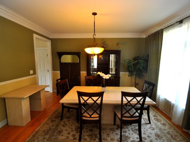 606 Reserve Ln, Joliet, IL 60431 - dining space featuring wood finished floors and crown molding