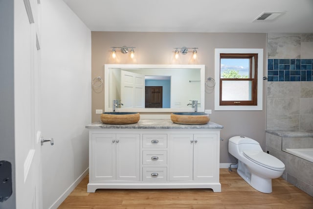 1125 Huntleigh Dr, Naperville, IL 60540 - full bath featuring toilet, double vanity, and wood finished floors