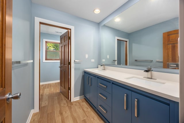 1125 Huntleigh Dr, Naperville, IL 60540 - full bath with wood finished floors, double vanity, baseboards, and recessed lighting