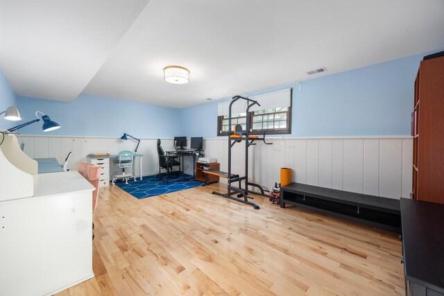 1125 Huntleigh Dr, Naperville, IL 60540 - workout area featuring wood finished floors and a wainscoted wall