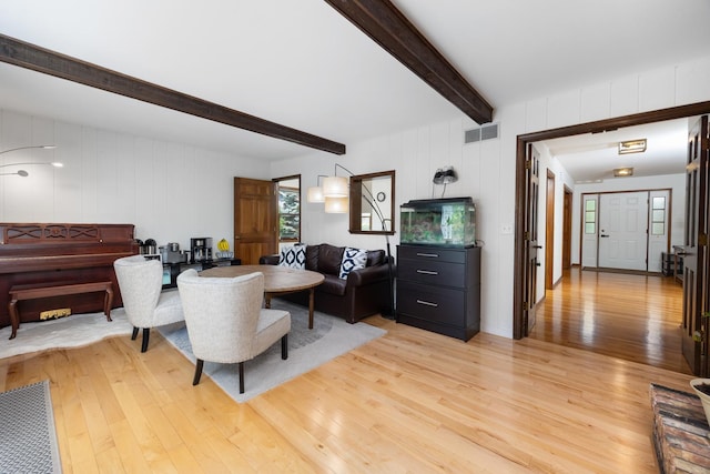 1125 Huntleigh Dr, Naperville, IL 60540 - living room with light wood-style flooring, beam ceiling, and a decorative wall