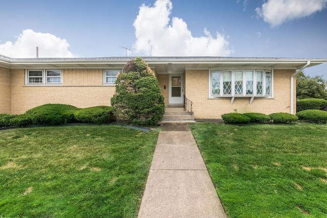 8560 W Winona St, Chicago, IL 60656 - view of front of house featuring a front lawn and brick siding