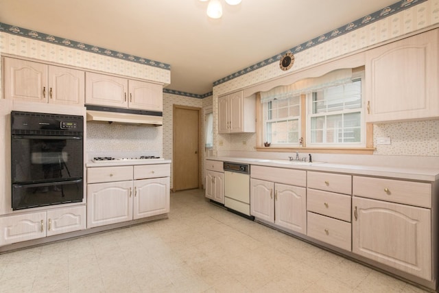 8560 W Winona St, Chicago, IL 60656 - kitchen featuring a warming drawer, white appliances, under cabinet range hood, wallpapered walls, and light countertops