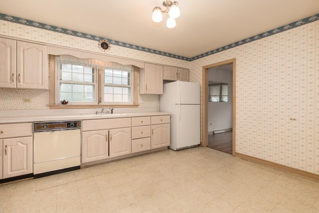 8560 W Winona St, Chicago, IL 60656 - kitchen featuring white appliances, light countertops, wallpapered walls, light flooring, and a chandelier