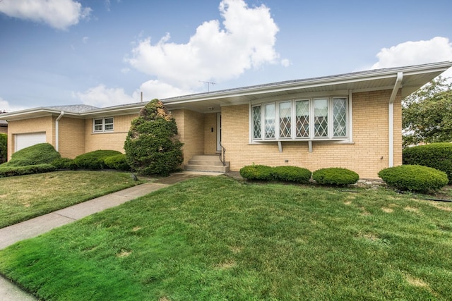 8560 W Winona St, Chicago, IL 60656 - view of front of property with a garage, a front lawn, and brick siding
