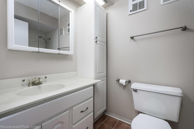 9737 N Fox Glen Dr Unit 4A, Niles, IL 60714 - bathroom featuring vanity, toilet, tile patterned floors, and baseboards