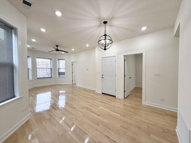 4032 W Wilcox St, Chicago, IL 60624 - unfurnished dining area with light wood-style floors, recessed lighting, ceiling fan, and baseboards