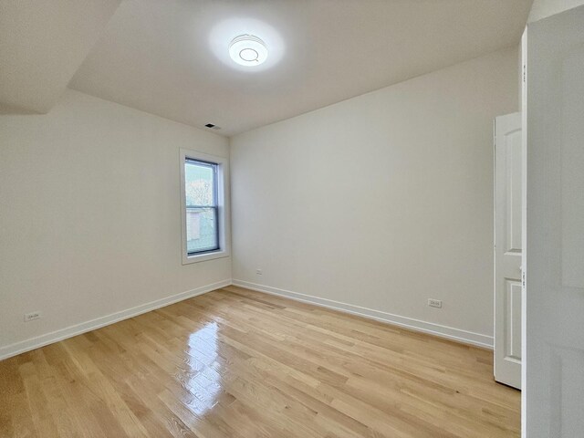 4032 W Wilcox St, Chicago, IL 60624 - spare room with light wood-style flooring and baseboards