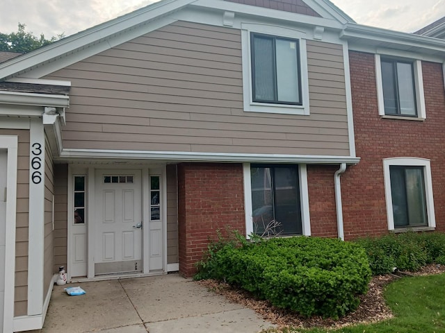 366 Pinetree Ln Unit B1, Schaumburg, IL 60193 - doorway to property featuring brick siding