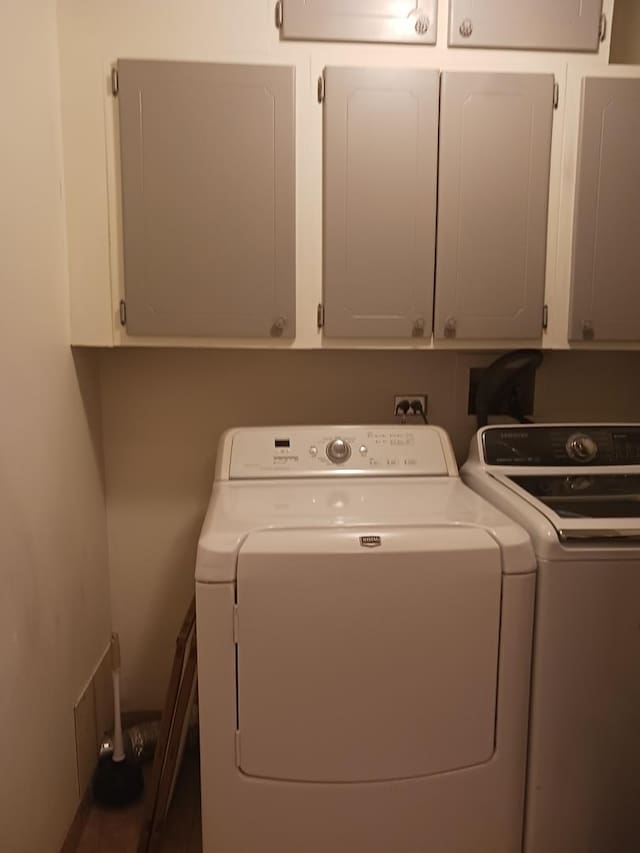 366 Pinetree Ln Unit B1, Schaumburg, IL 60193 - laundry area with cabinet space, washing machine and dryer, and electric panel