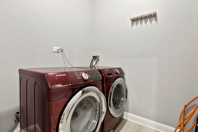 1505 N Talman Ave Unit 1, Chicago, IL 60622 - washroom with washer and clothes dryer, a garage, and baseboards